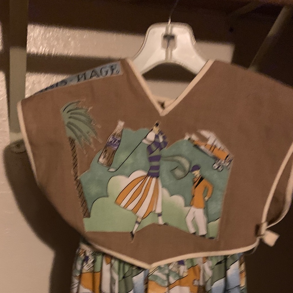 A children’s dress from Paris France size small for a petite child.